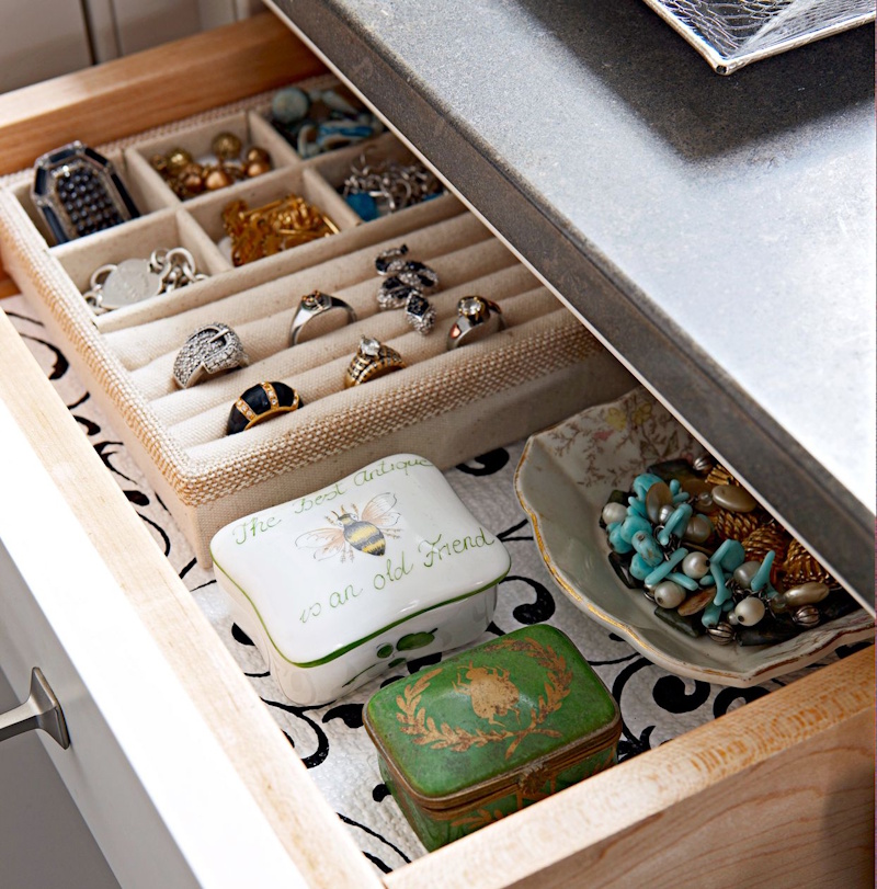 Professional vintage jewelry collection storage system showing organized compartments, anti-tarnish papers, individual pouches, and documentation for preserved antique and costume jewelry pieces with proper climate-controlled environment - collection care guide InfoProds 2026