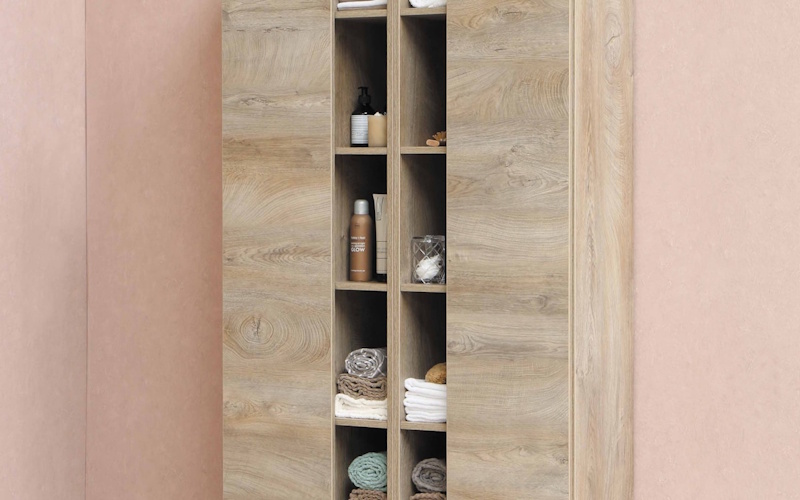 Mirrors and Lighting - Optical Tricks to Expand Small Spaces Large round mirror and modern pendant lighting creating illusion of space in compact living area