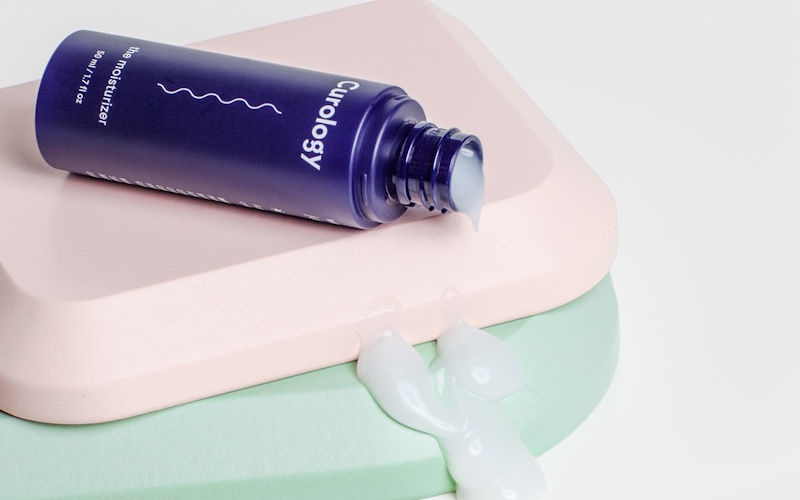 Woman washing face with gentle cleanser demonstrating proper cleansing technique for healthy skincare routine