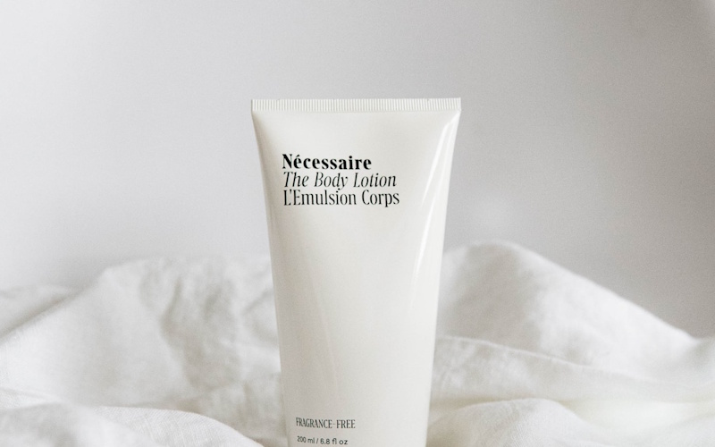 Moisturizer cream being applied to face showing hydration step in daily skincare routine for beginners