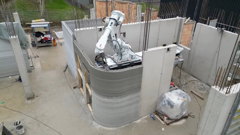 3D Printing Construction Technology - Additive Manufacturing Creating Buildings in Record Time Large-scale 3D printer creating concrete building walls layer by layer demonstrating revolutionary construction technology