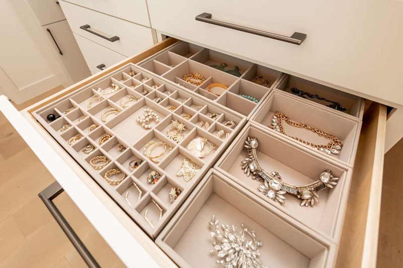 Jewelry Storage Solutions - Proper Organization Preventing Scratches Tarnish and Damage Organized jewelry box with separated compartments storing rings necklaces and earrings preventing damage and tangling