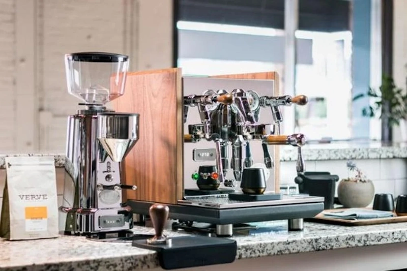 Different Types of Coffee Machines - Drip Espresso French Press Pour Over Assorted coffee machines and brewing equipment displayed on modern kitchen counter