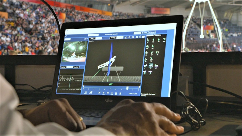 Artificial Intelligence Gymnastics Judging Technology Future AI computer vision technology for gymnastics judging showing future hybrid system combining automated technical scoring with human artistic evaluation reducing bias - InfoProds 2026.