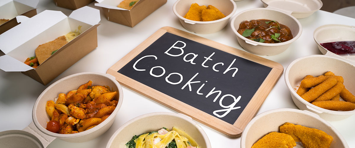 Batch Cooking Techniques - Efficient Methods for Preparing Multiple Meals Simultaneously Sheet pans with roasted vegetables and proteins demonstrating batch cooking meal prep techniques