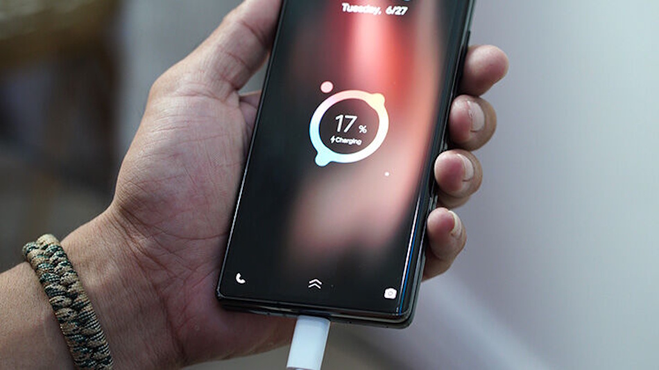 High-capacity silicon anode battery technology in tri-fold smartphones showing 5600mAh power cells, 66-watt fast charging capabilities, wireless charging support, and advanced power management systems enabling all-day usage on massive displays - InfoProds 2026