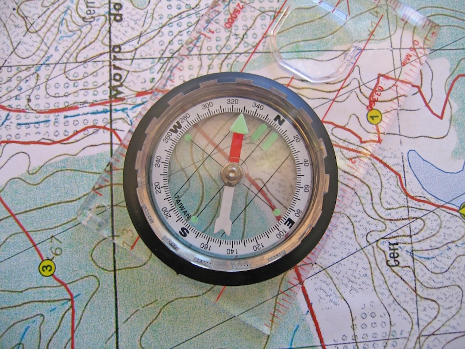 Triangulation Position Finding with Multiple Landmarks Advanced navigation technique showing triangulation process using compass bearings to multiple mountain peaks for determining precise location on topographic map during backcountry travel - InfoProds 2026