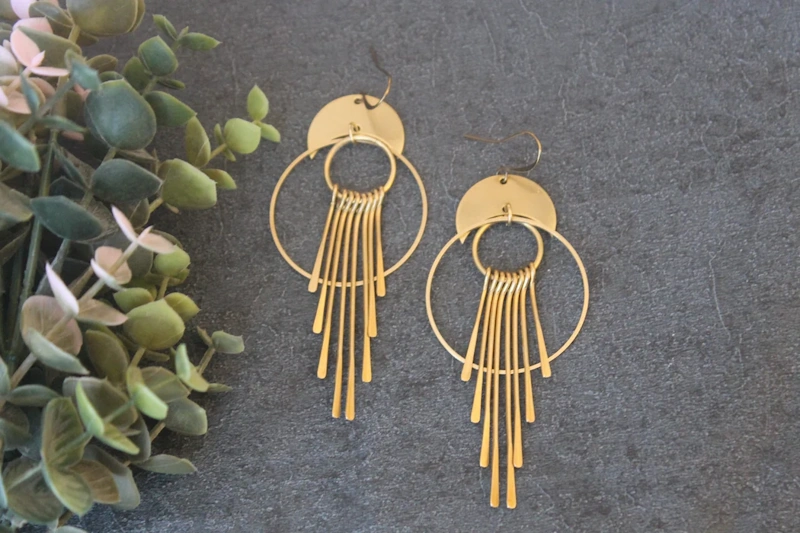 Bold Statement Earrings - Oversized Hoops and Dramatic Designs Oversized statement earrings featuring hoops chandelier designs and bold drop earrings