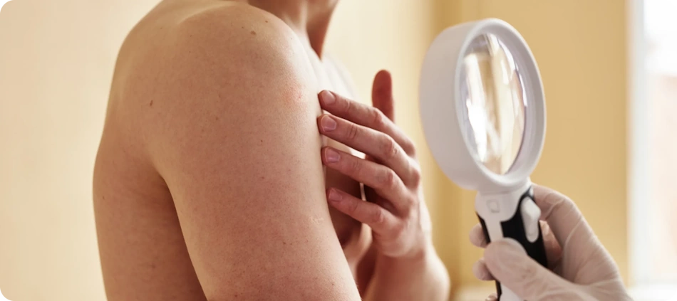 Dermatologist examining patient's rough dry skin condition during professional consultation for treatment plan Professional board-certified dermatologist carefully examining patient's rough dry skin condition on hands during medical consultation to diagnose underlying causes and develop personalized prescription treatment plan for severe xerosis - InfoProds 2026 healthcare beauty