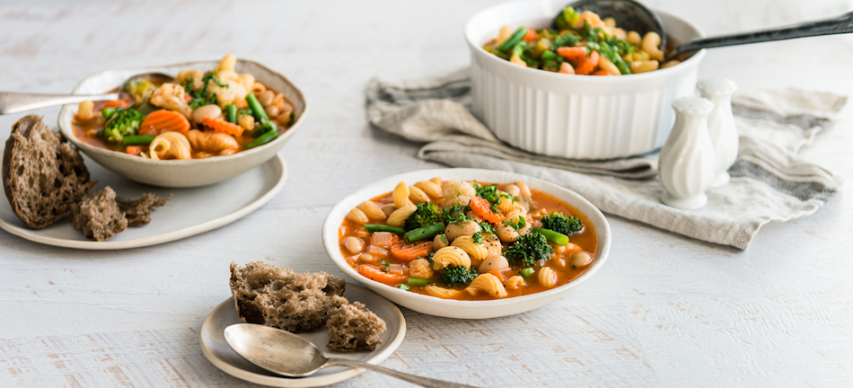 Delicious healthy meals prepared using combination of fresh frozen and canned vegetables Nutritious colorful meals and dishes prepared with strategic combination of fresh frozen and canned vegetables demonstrating practical cooking applications and optimal ingredient selection - InfoProds Kitchen Cooking 2026