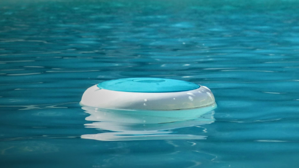 Close-up view of sophisticated AI-powered pool water chemistry sensor floating in swimming pool measuring real-time pH levels, chlorine concentration, alkalinity, and temperature with precision electrochemical technology and wireless data transmission capabilities for automated pool monitoring - InfoProds 2026