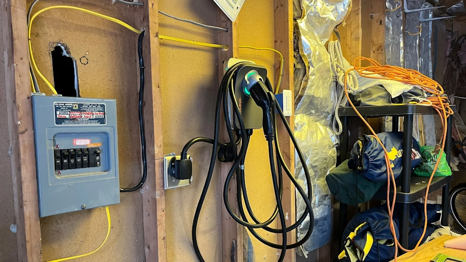 Home EV Charger Installation Circuit Wiring Garage Licensed electrician installing dedicated 240-volt circuit for Level 2 EV charger in residential garage showing proper conduit, wiring, and code-compliant installation techniques - InfoProds 2026