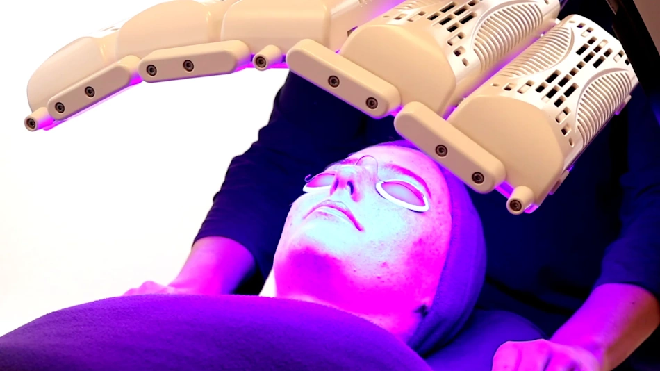 Woman with Glowing Healthy Skin After LED Treatment Radiant woman with healthy glowing skin after completing LED light therapy face mask treatment protocol showing improved texture collagen and anti-aging benefits - InfoProds 2026