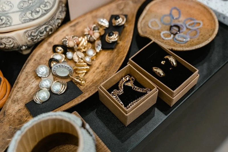 Curated collection of antique and vintage jewelry pieces showcasing diverse historical hallmarks from different eras including Victorian Georgian and Art Deco period maker's marks - InfoProds 2026
