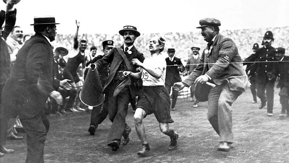 Historical Olympic Sprint Race Finish Historical Olympic Games track and field 100-meter sprint finish showing evolution of finish line technique through decades of championship competition - Olympic athletics history InfoProds 2026