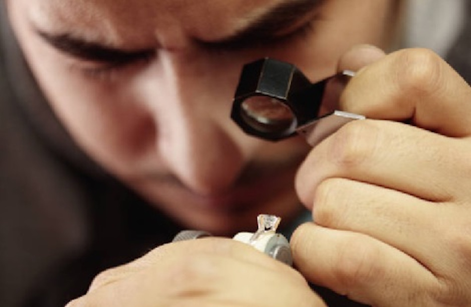 Professional Jeweler Inspecting Necklace Clasp Under Magnification Professional jeweler using magnifying loupe to inspect necklace clasp for wear patterns, metal fatigue, and early failure signs during preventive maintenance examination - InfoProds 2026